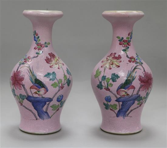 A pair of Chinese pink sgraffito ground famille rose vases
